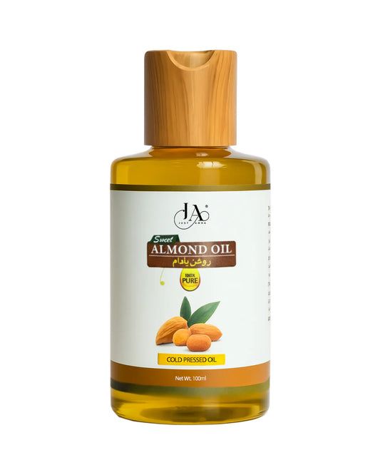 Just Amna sweet almond oil bottle with almonds and oil drops, 100ml