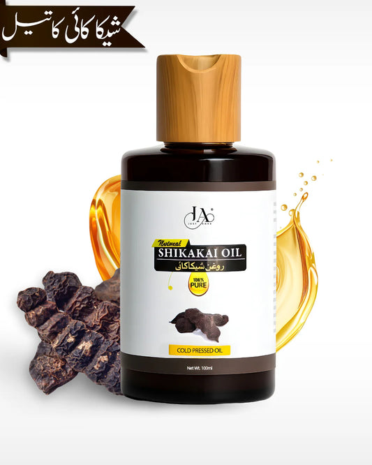 Just Amna shikakai oil bottle with golden oil splash and pods beside it