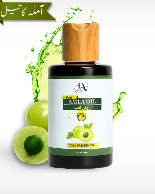 Just Amna vital amla oil with cut amla and green liquid splash, 100ml