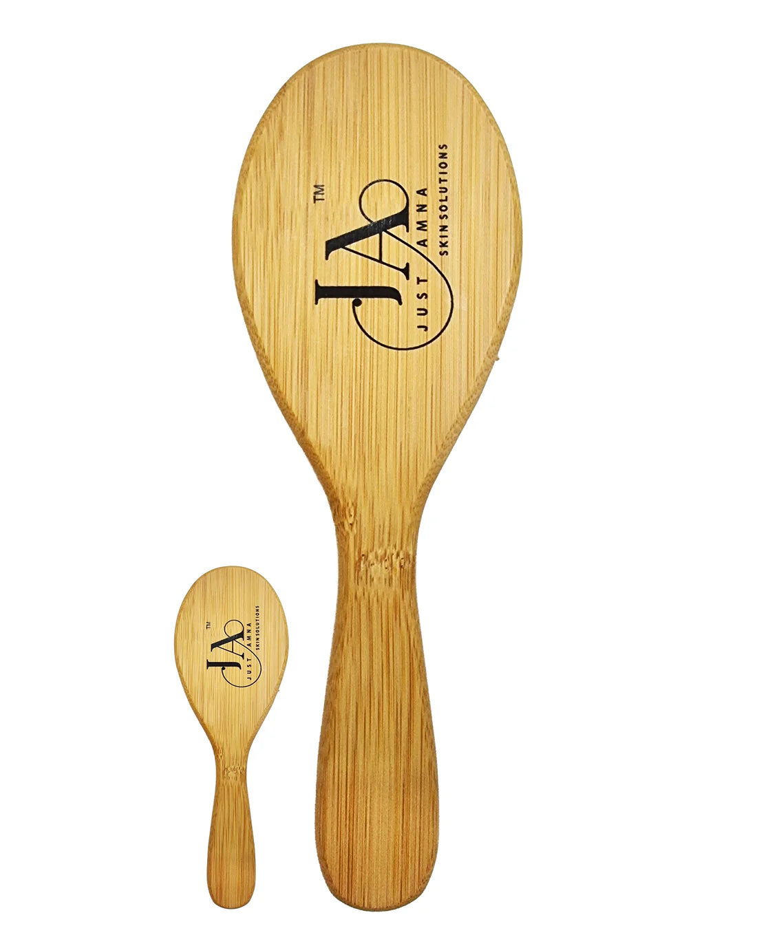 Back view of the Just Amna bamboo hair brush with engraved logo.