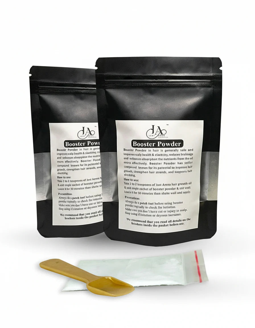 Just Amna Booster Powder in a black stand-up pouch for hair growth.