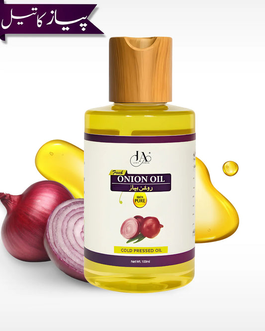 Just Amna pure cold pressed onion hair oil bottle with red onion slices.