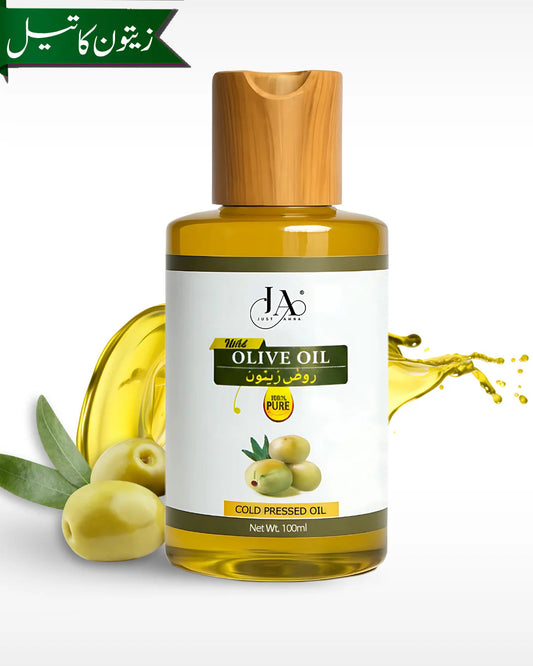 100% Pure Cold Pressed Olive Oil by Just Amna with fresh green olives.