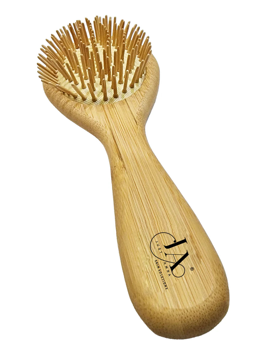 Back of Just Amna oval hair brush showing smooth natural wood grain.