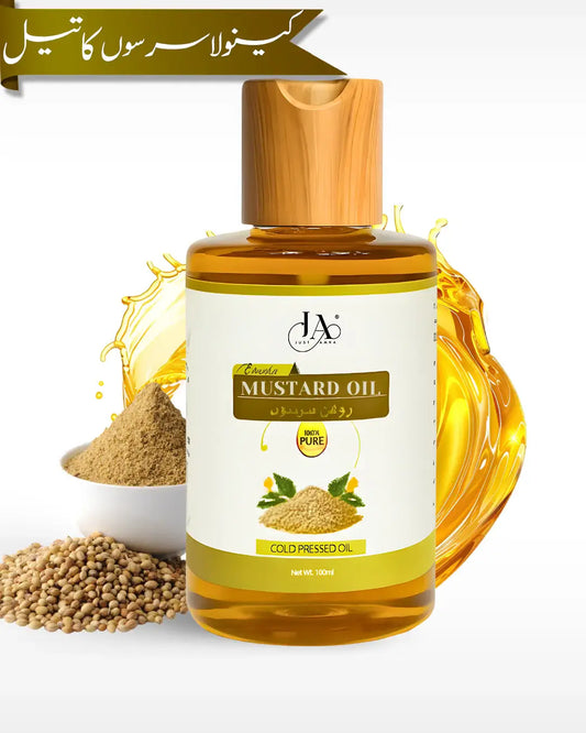 Just Amna 100% pure cold pressed mustard oil bottle with mustard seeds and oil splash.
