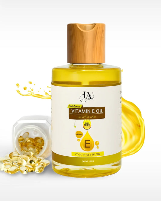 Just Amna 100% pure cold pressed Vitamin E oil bottle with softgel capsules.
